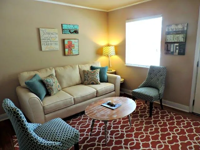 Living room with blue chairs in a Dana Point rental property